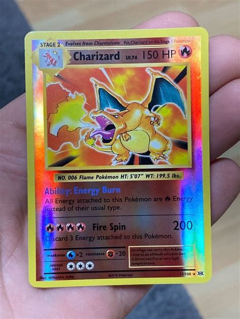 This Pokémon TCG card features the iconic Charizard from the XY Evolutions set. The card is a Stage 2 Fire-type Pokémon with 150 HP and a powerful attack. It is a Holo Rare card with a Reverse Holo finish, making it a must-have for any collector or player. It is a great addition to any Pokémon TCG collection and is sure to …